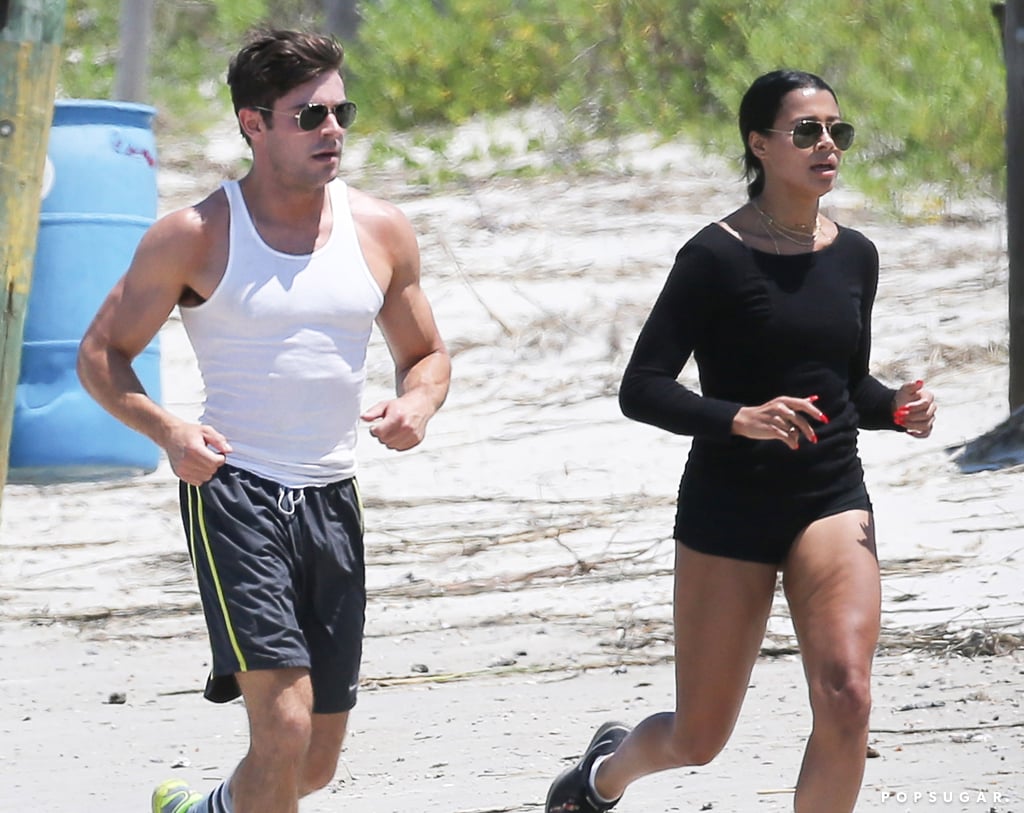 Zac Efron and Sami Miró made one hot pair when they hit the beach in Georgia on Sunday to sweat it out together. The cute couple went for a run on the sand, sporting shorts and sunglasses while jogging along the water. Zac has been busy filming Dirty Grandpa, and there have been plenty of must-see pictures from the set. Last week, he and his costar Robert De Niro were spotted shirtless on set, and Zac has also been seen wearing underwear and rocking a crop top while filming the movie. The actor's weekend workout with his girlfriend is the latest of many cute moments for the couple, who had a smoothie date in late April after she joined him at the MTV Movie Awards earlier that month. Keep reading for more pictures of the pair's beach day, then see Zac and Sami's sweetest social media snaps and get to know more about Zac's girlfriend!