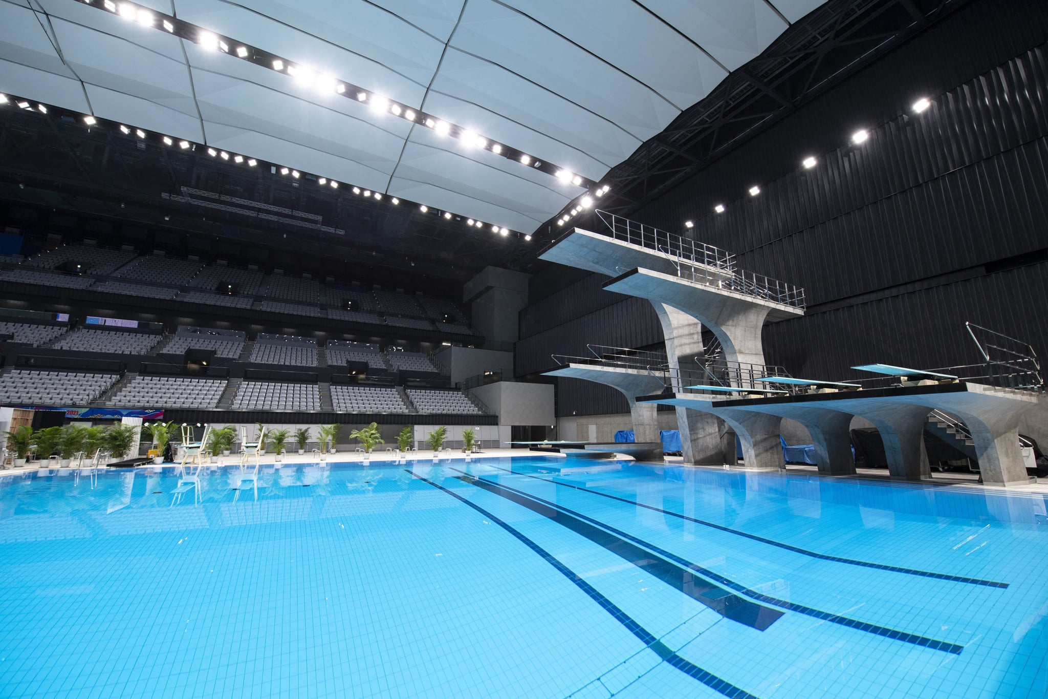 This picture shows a general view of the diving pool at the Tokyo Aquatics Centre - the venue for swimming, diving and artistic swimming at the 2020 Tokyo Olympics and Paralympics Games - during a training session for the Japan Swimming Championships competition in Tokyo on April 6, 2021. (Photo by CHARLY TRIBALLEAU / AFP) (Photo by CHARLY TRIBALLEAU/AFP via Getty Images)