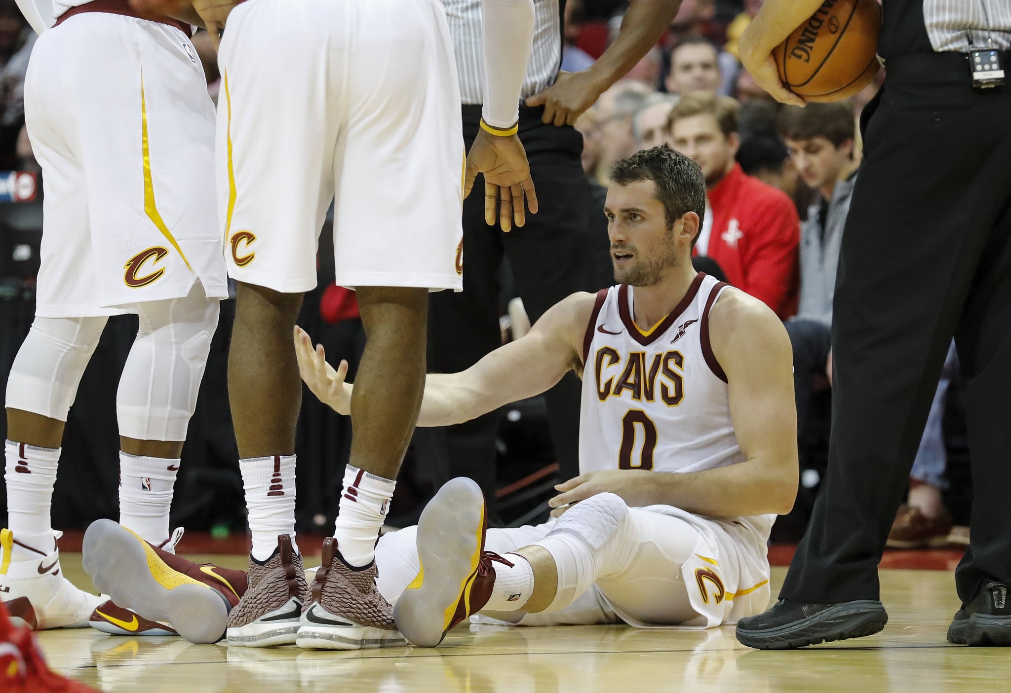 HOUSTON, TX - NOVEMBER 09:  Kevin Love #0 of the Cleveland Cavaliers is helped from the floor in the first half against the Houston Rockets at Toyota centre on November 09, 2017 in Houston, Texas.  NOTE TO USER: User expressly acknowledges and agrees that, by downloading and or using this photograph, User is consenting to the terms and conditions of the Getty Images licence Agreement.  (Photo by Tim Warner/Getty Images)