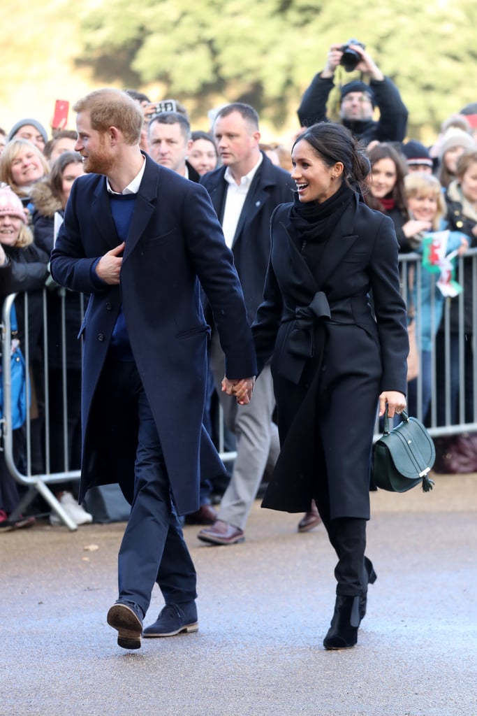 In January 2018, Meghan ditched the royal protocol by wearing a jet-black outfit, which she accessorized with a green DeMellier handbag.