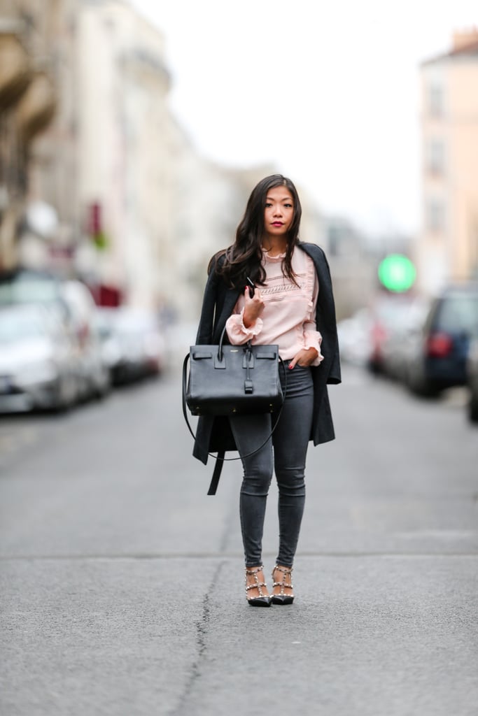 A Pink Ruffled Top, Black Denim, and a Coat Draped Over Your Shoulders A Pink Ruffled Top, Black Denim, and a Coat Draped Over Your Shoulders