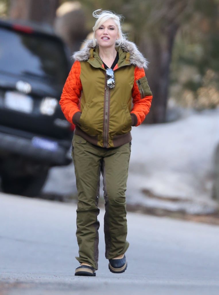The singer's Winter vacations have meant plenty of opportunities for her to bundle up. Instead of a common black puffer, she picked an army-green style with quilted orange sleeves and a furry hood from her L.A.M.B. for Burton line.