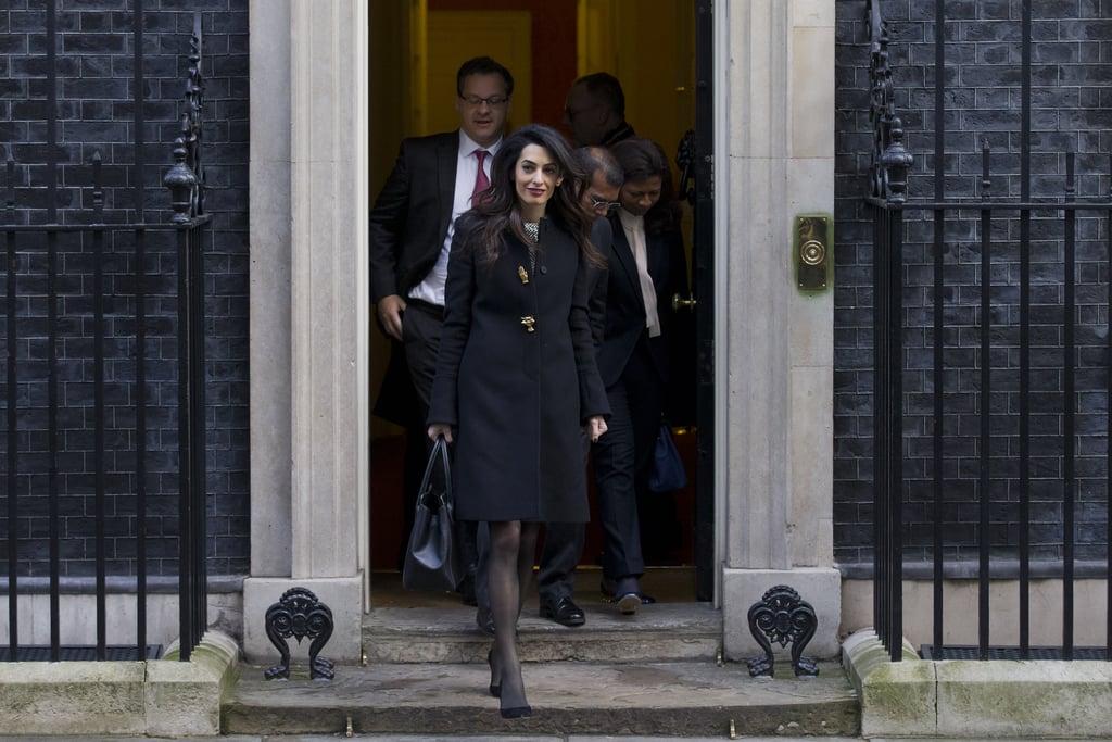 Amal Clooney Wearing a Black Coat With Gold Buttons