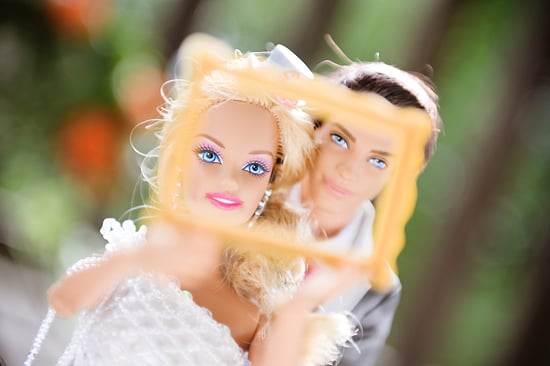 The happy couple look through a frame.
Photo by BdG Photography via Rock n Roll Bride