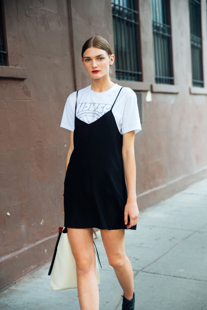 For the most classic of T-shirt and dress looks, throw a black silk slip dress over a vintage printed tee.