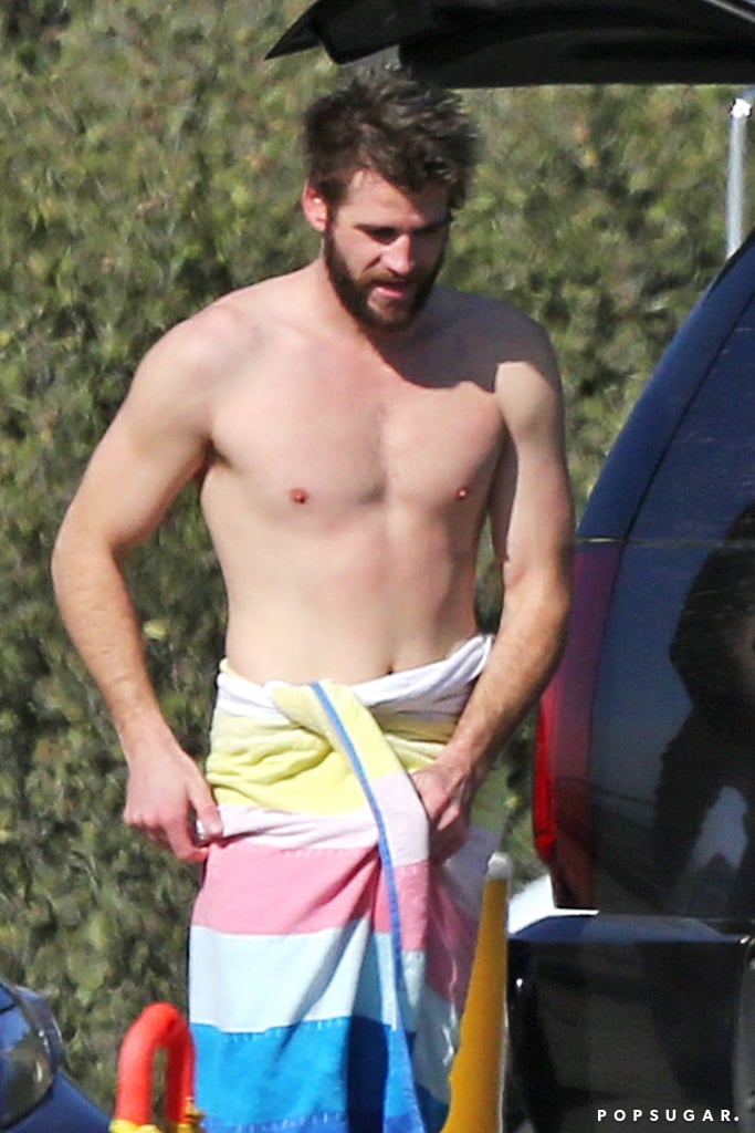 While most of us are out here braving the cold Winter weather, Liam Hemsworth is back in Malibu soaking up the sun. Following his trip to NYC with Miley Cyrus last month, the actor hit the beach for a day of surfing on Thursday. Liam was spotted riding a few waves with a pal, and after he was done, he blessed us with a beautiful glimpse of his shirtless body while toweling off in back of his SUV. 

    Related:

            
            
                                    
                            

            Every Romantic Moment Miley Cyrus and Liam Hemsworth Shared This Year
        
    
The last time we saw Liam on the red carpet was back in October when he attended the LA premiere of Thor: Ragnarok to support his brother Chris, and that's probably because he's been busy working on his upcoming film, Killerman. Fun fact: the movie is actually being shot on Tybee Island in Savannah, GA, where Liam and Miley first met while filming The Last Song in 2009.