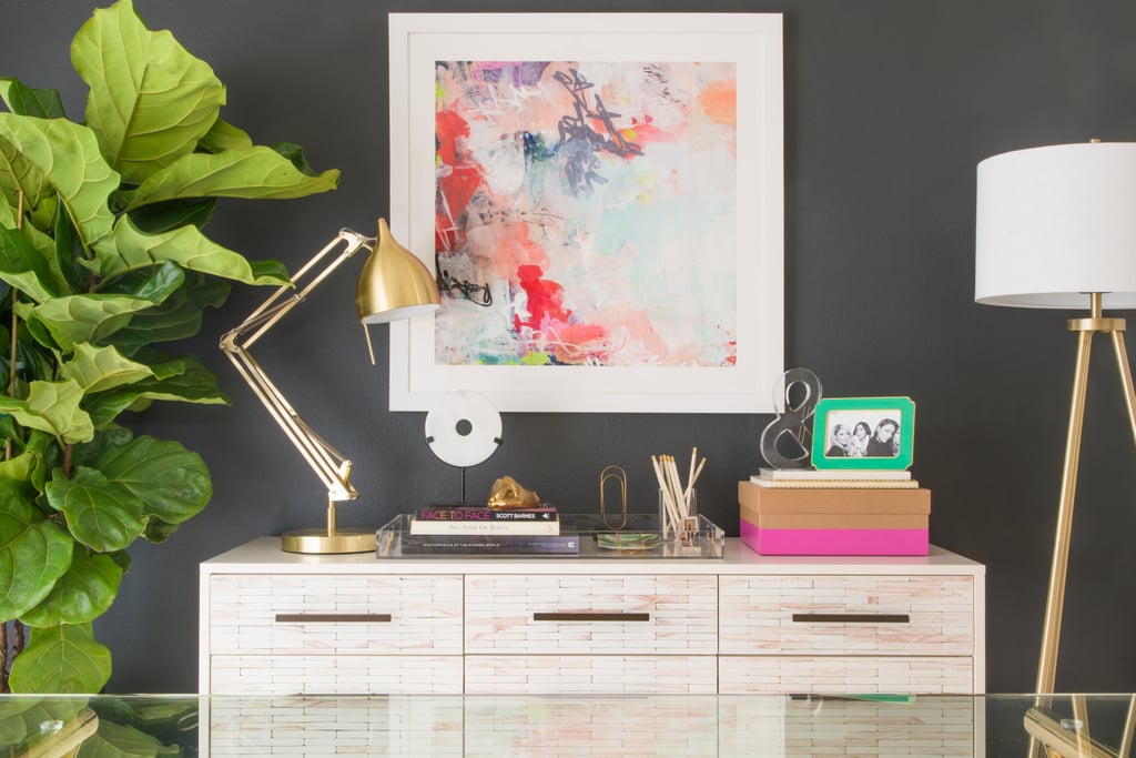 "I	especially	love	the	excitement	of	utilizing	a	black	accent	wall	as	well	as	the	mix	of	textures	and	finishes," explains designer Deanna, who strove for a "clean-lined,	contemporary-glam	style."