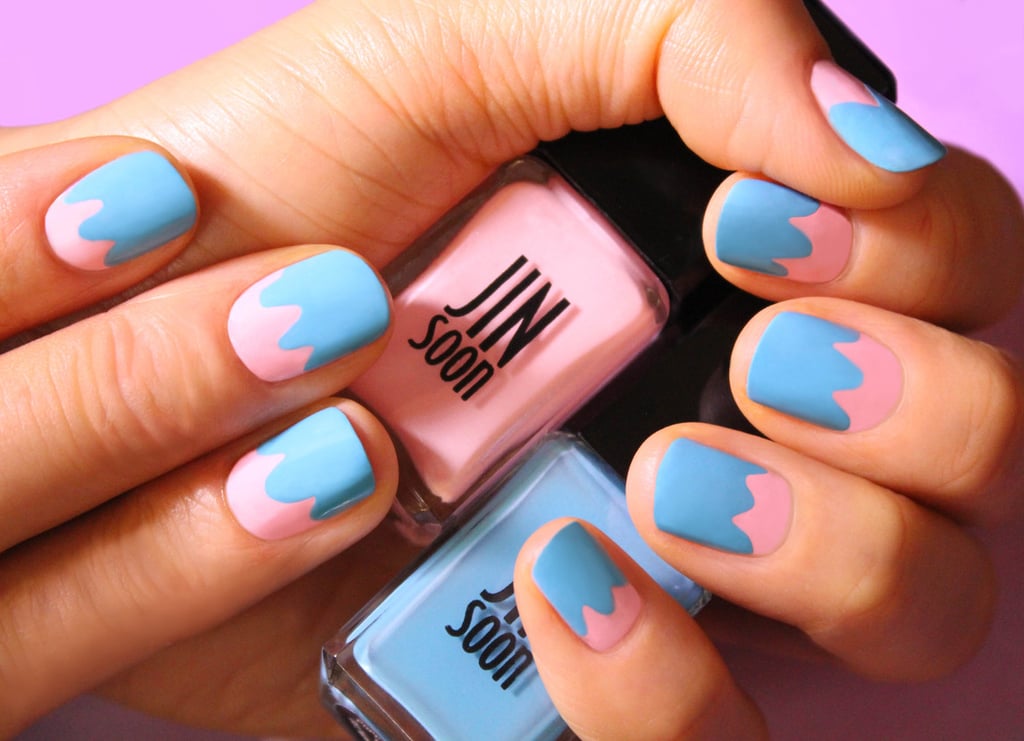 File and shape your nails in a natural square or roundish shape.
Apply a base coat like JINsoon Power Coat ($18).
Apply JINsoon Dolly Pink ($18) on the entire nail bed.
Apply JINsoon Poppy Blue ($18) about two-thirds of the way from the top of the nail, closer to the cuticle area, creating a few curved lines and filling in to the tip of the nail.
Finish with a high-shine top coat like JINsoon Top Gloss ($18).