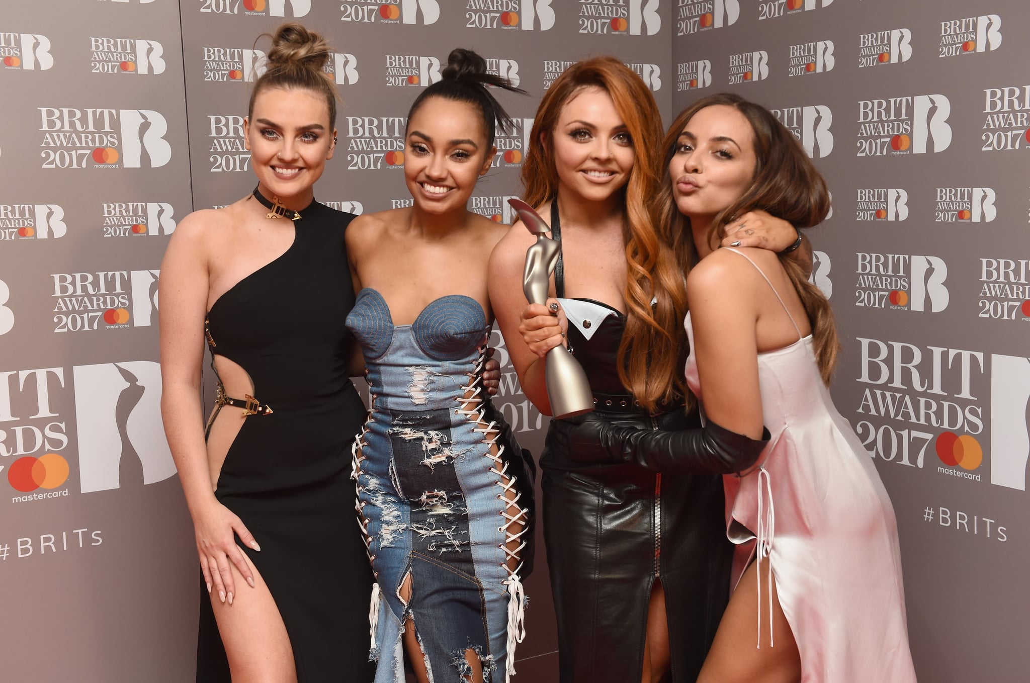 LONDON, ENGLAND - FEBRUARY 22:  (EDITORIAL USE ONLY) (L-R) Perrie Edwards, Leigh-Anne Pinnock, Jesy Nelson and Jade Thirlwall of Little Mix pose with their award for Best British Single in the winner's room at The BRIT Awards 2017 at The O2 Arena on February 22, 2017 in London, England.  (Photo by Samir Hussein/WireImage)
