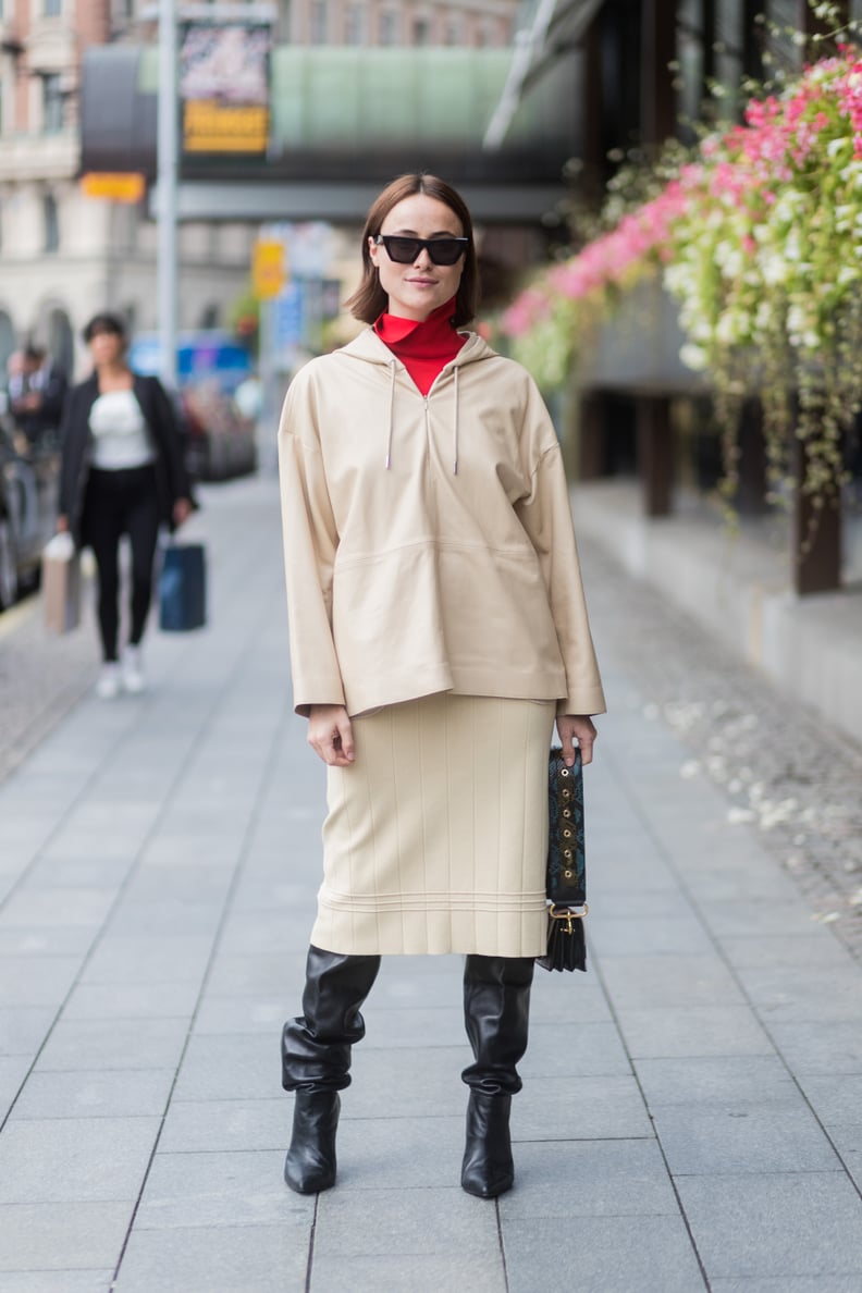 Let a Knee-Length Skirt Fall Beyond Slouchy Knee-High Boots