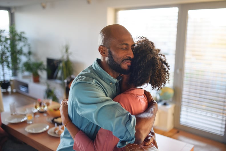 Stepdad consoling his teenage stepdaughter