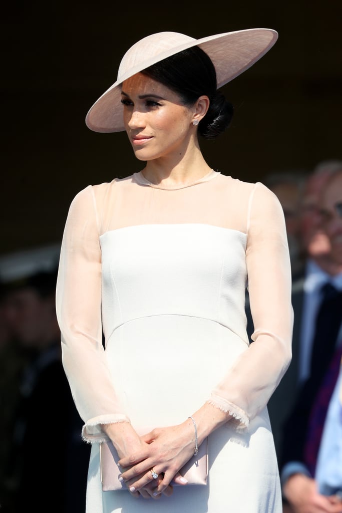 Markle looked elegant as ever in a similar, looser style at the Prince of Wales's 70th birthday celebration the year prior, where she wore a peachy-pink Goat dress featuring sheer sleeves with raw edges.