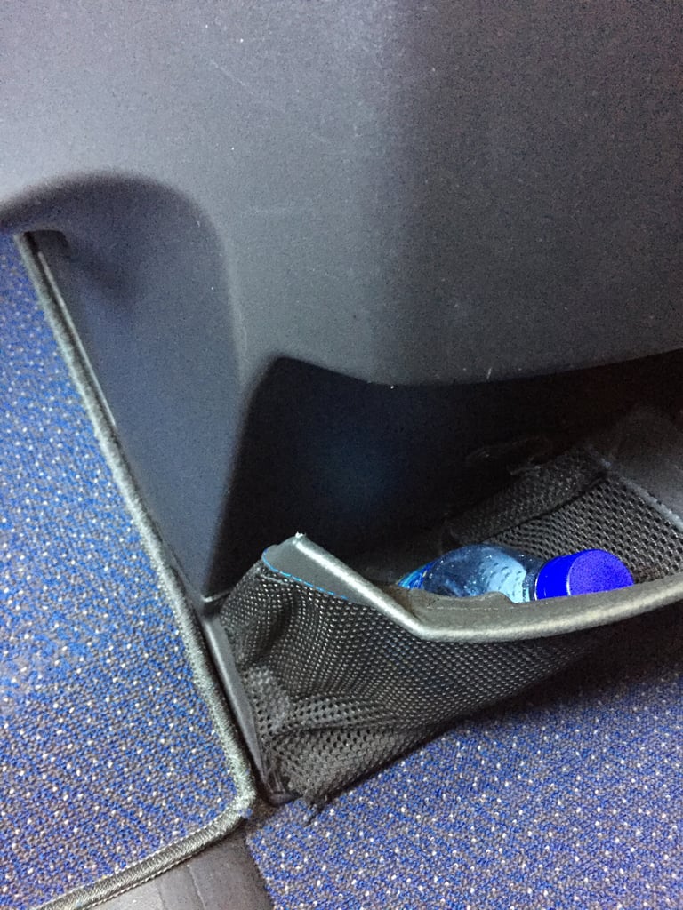 Plus there was another small compartment by your feet, which was convenient since you can't have any bags at your feet for takeoff and landing. The flight attendant helpfully put my purse up in the overhead compartment and brought it back down again for me, so it wasn't really an issue.