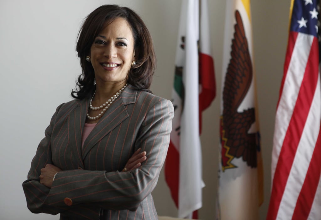 Kamala stood for a portrait as District Attorney for San Francisco in April 2009, coordinating gold-rimmed pearl stud earrings with a double strand of pearls and a fresh pink pinstripe blazer.