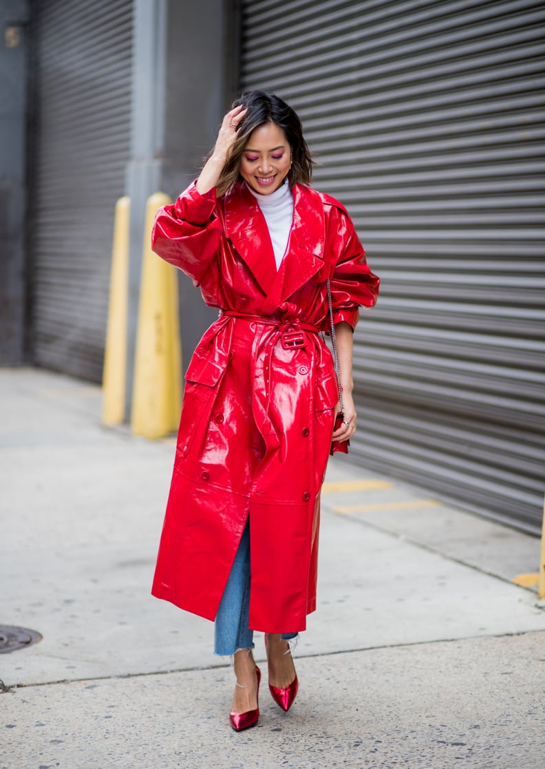 With a White Turtleneck Sweater, a Bright Red PVC Trench Coat, and Ruby Heels