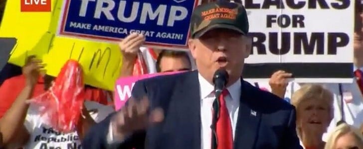 White People Holding Blacks For Trump Signs