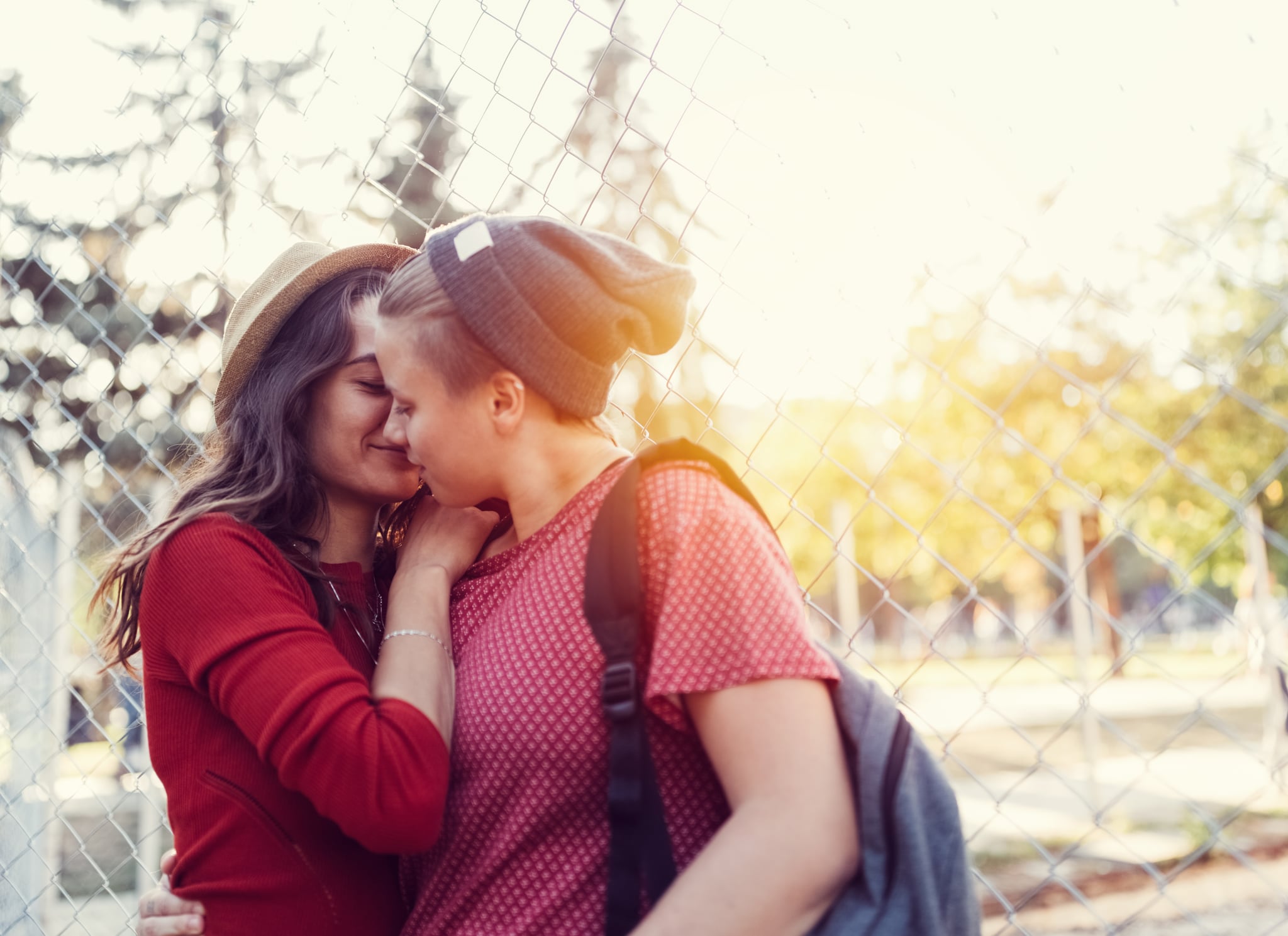 Homosexual couple kissing in the city park