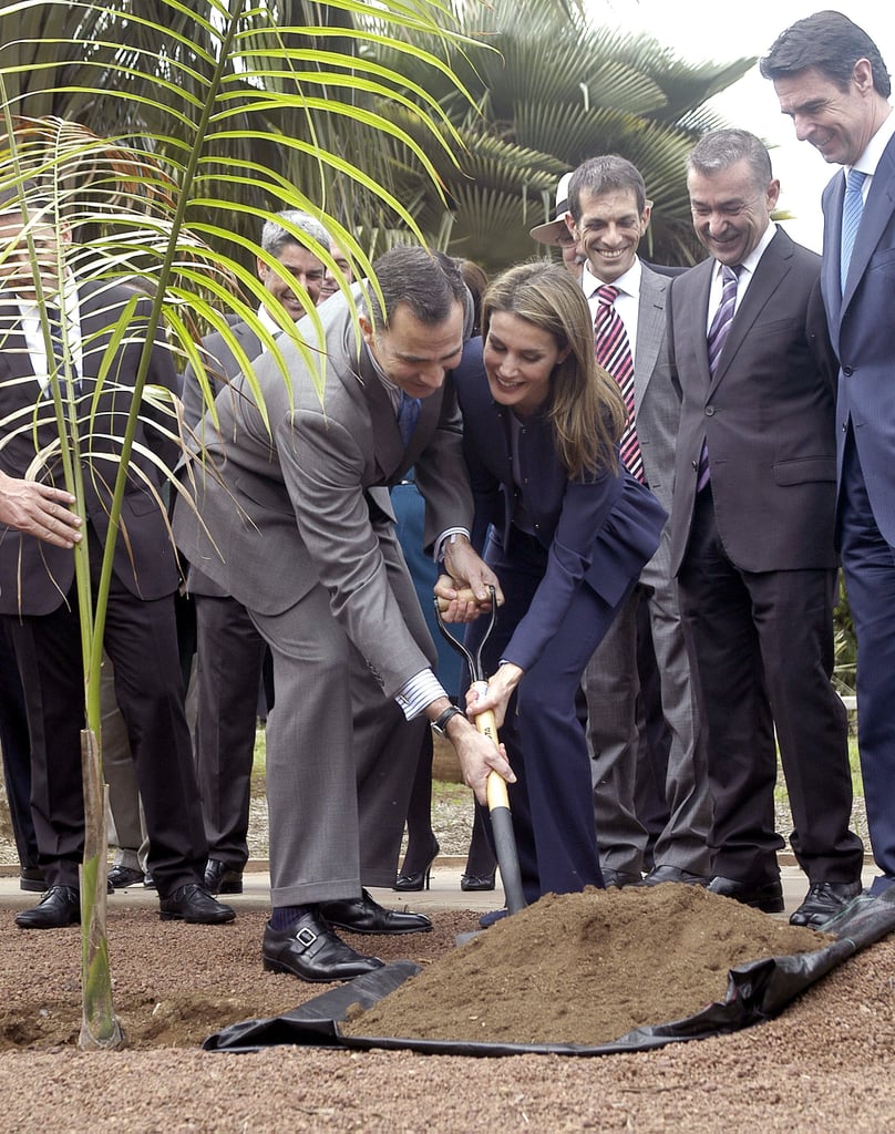 Letizia and Felipe giggled while planting a tree during a January 2014 visit to Tenerife, Spain.