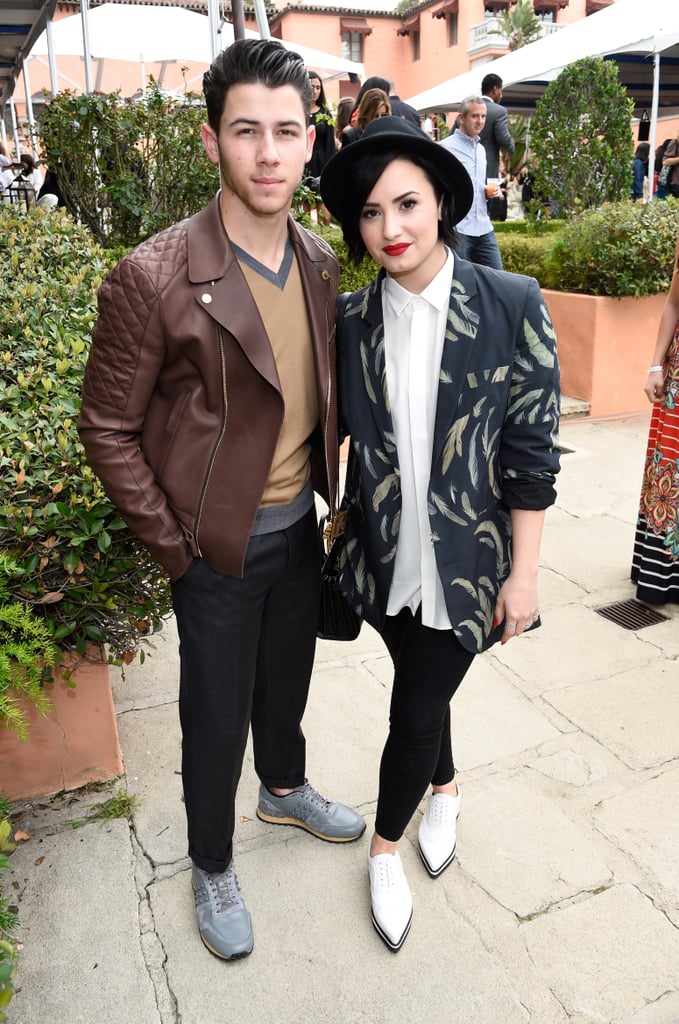 Nick Jonas and Demi Lovato hung out away from the crowd.