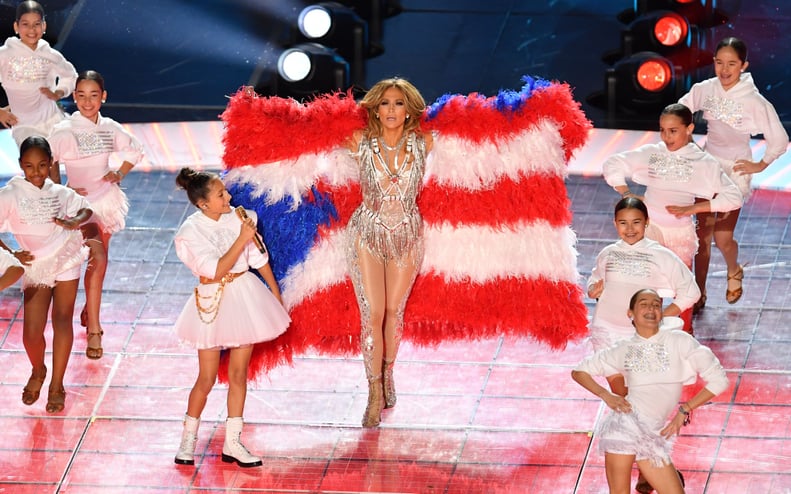 US singer Jennifer Lopez and her daughter Emme Muniz (L) perform during the halftime show of Super Bowl LIV between the Kansas City Chiefs and the San Francisco 49ers at Hard Rock Stadium in Miami Gardens, Florida, on February 2, 2020. (Photo by Angela We