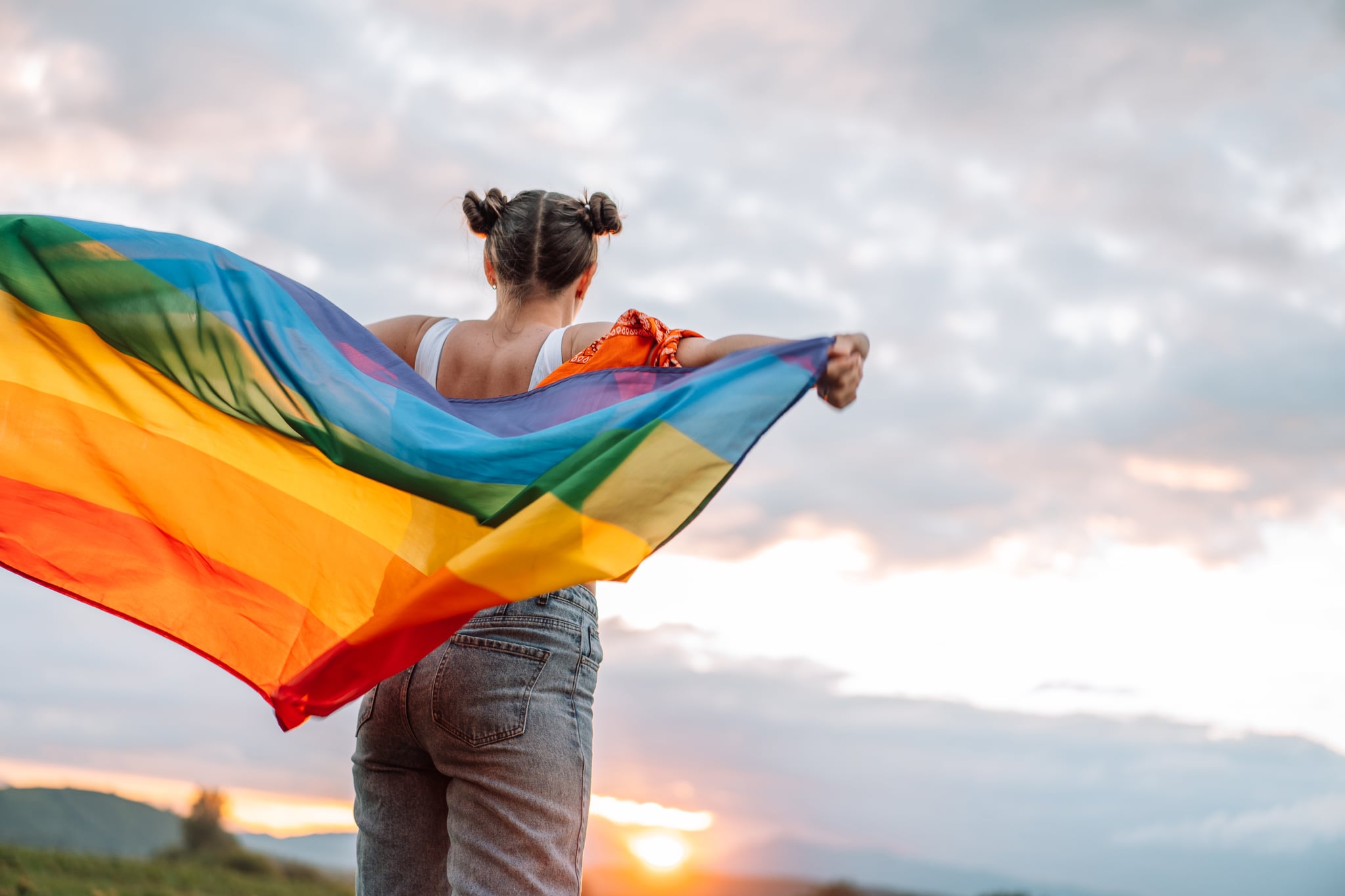 Woman Holding LGBTQ+ Flag 
