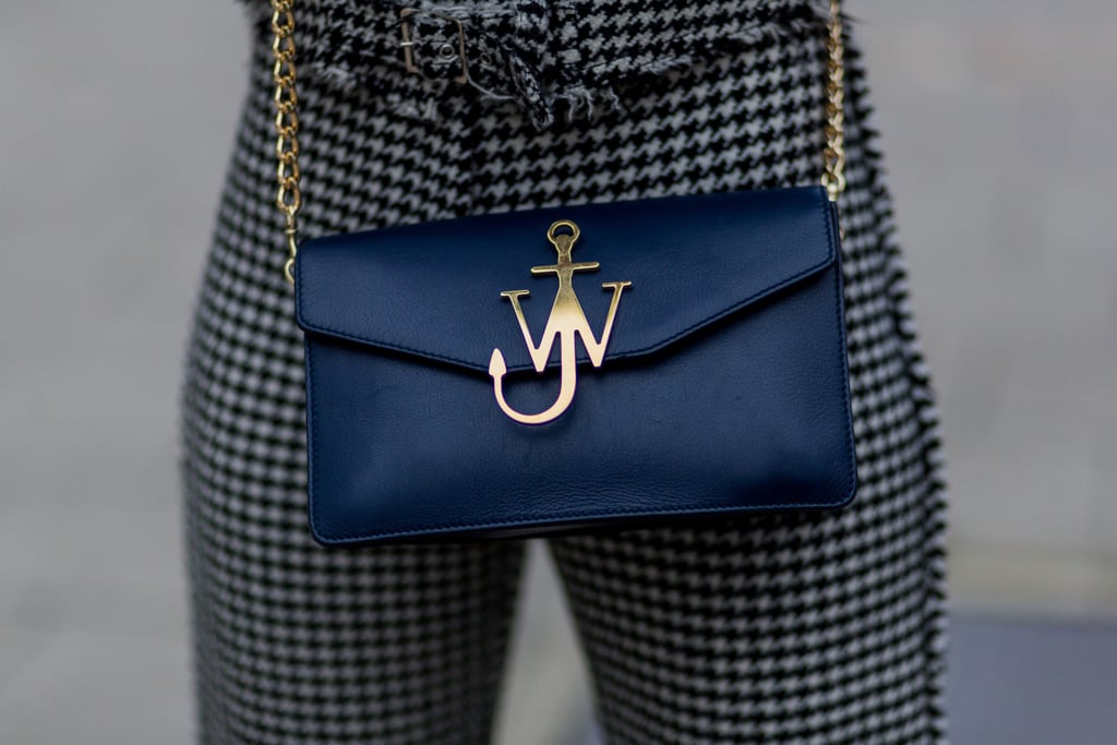 Ease your way into navy with minimalist accessories like this J.W. Anderson crossbody bag.