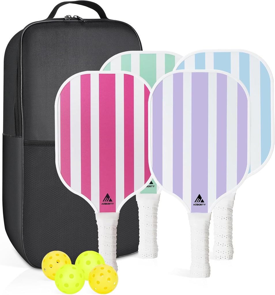 AOBORTY Pickleball Paddles, 4 Pack  ($35, originally $60)
I know I'm not the only one who thinks workouts are way better when pretty gear is involved. Case in point: this trending pickleball set. It comes with four pastel-striped paddles, six balls, and a matching carrying case so you can hit the court in style ASAP.