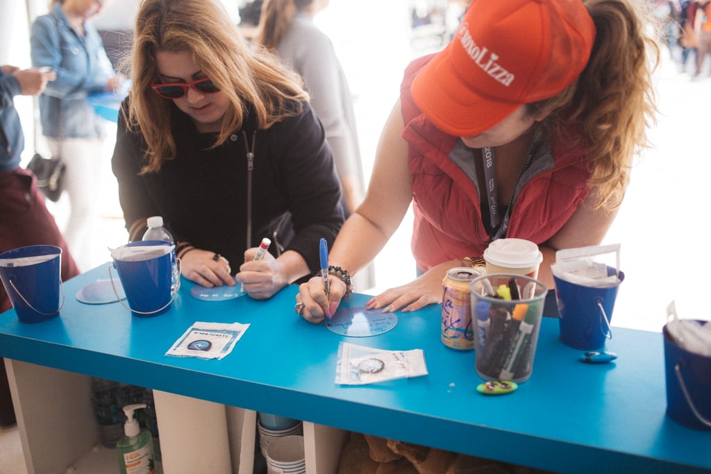 Two women wrote message for the wall.