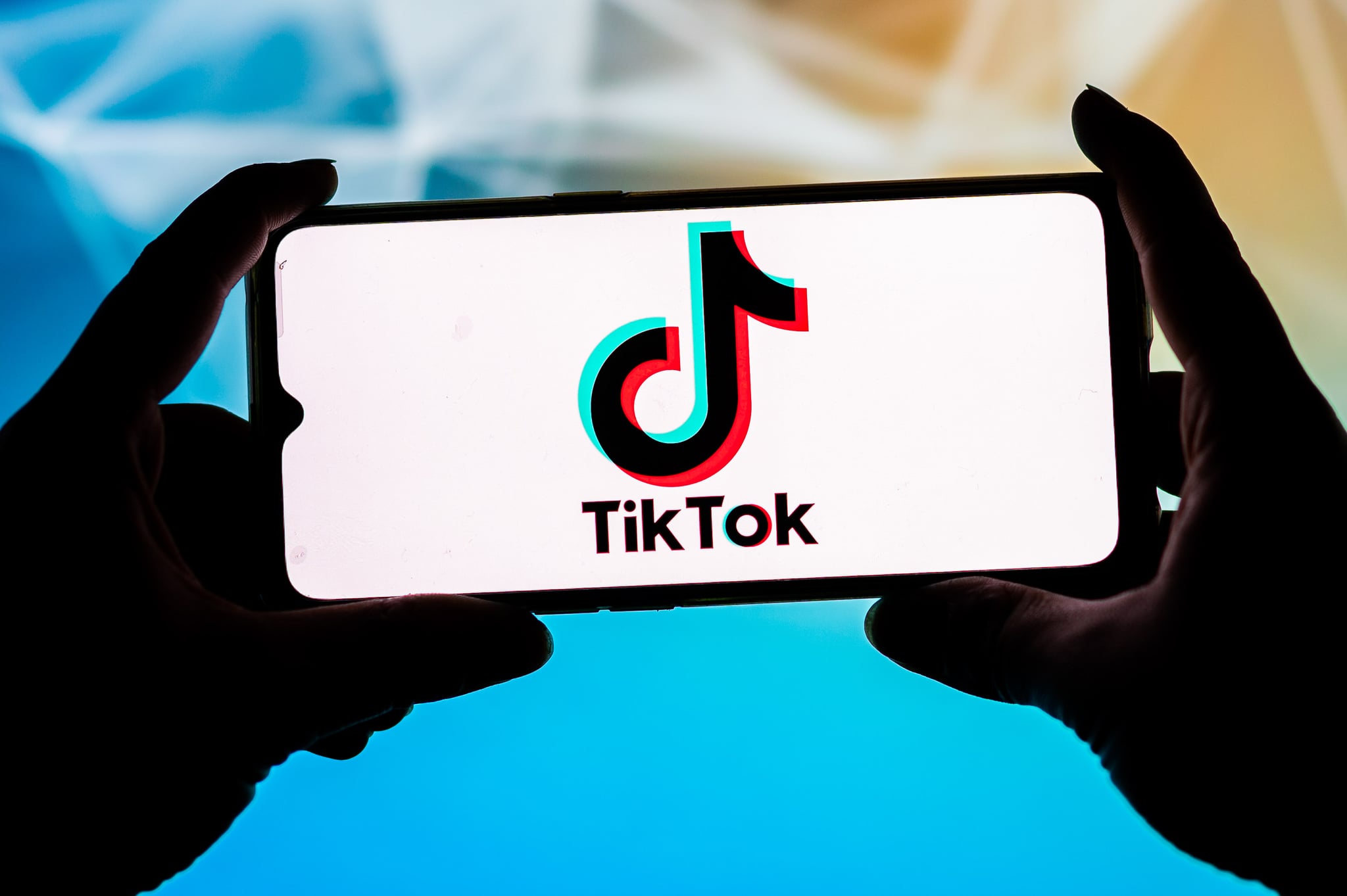 POLAND - 2021/09/23: In this photo illustration a TikTok logo seen displayed on a smartphone. (Photo Illustration by Mateusz Slodkowski/SOPA Images/LightRocket via Getty Images)