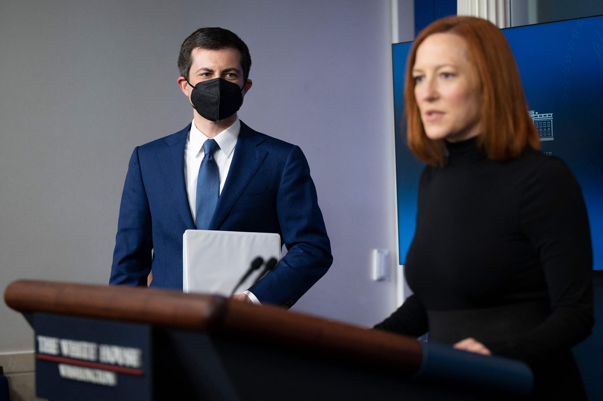 White House Press Secretary Jen Psaki (R) with US Secretary of Transportation Pete Buttigieg, speaks during the daily press briefing at the White House in Washington, DC, on April 9, 2021. (Photo by JIM WATSON / AFP) (Photo by JIM WATSON/AFP via Getty Images)