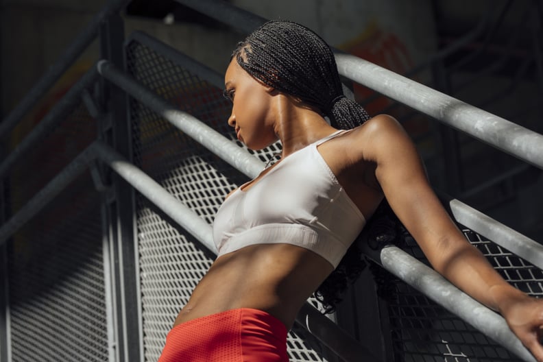 Portrait of beautiful African sportswoman standing outdoors.