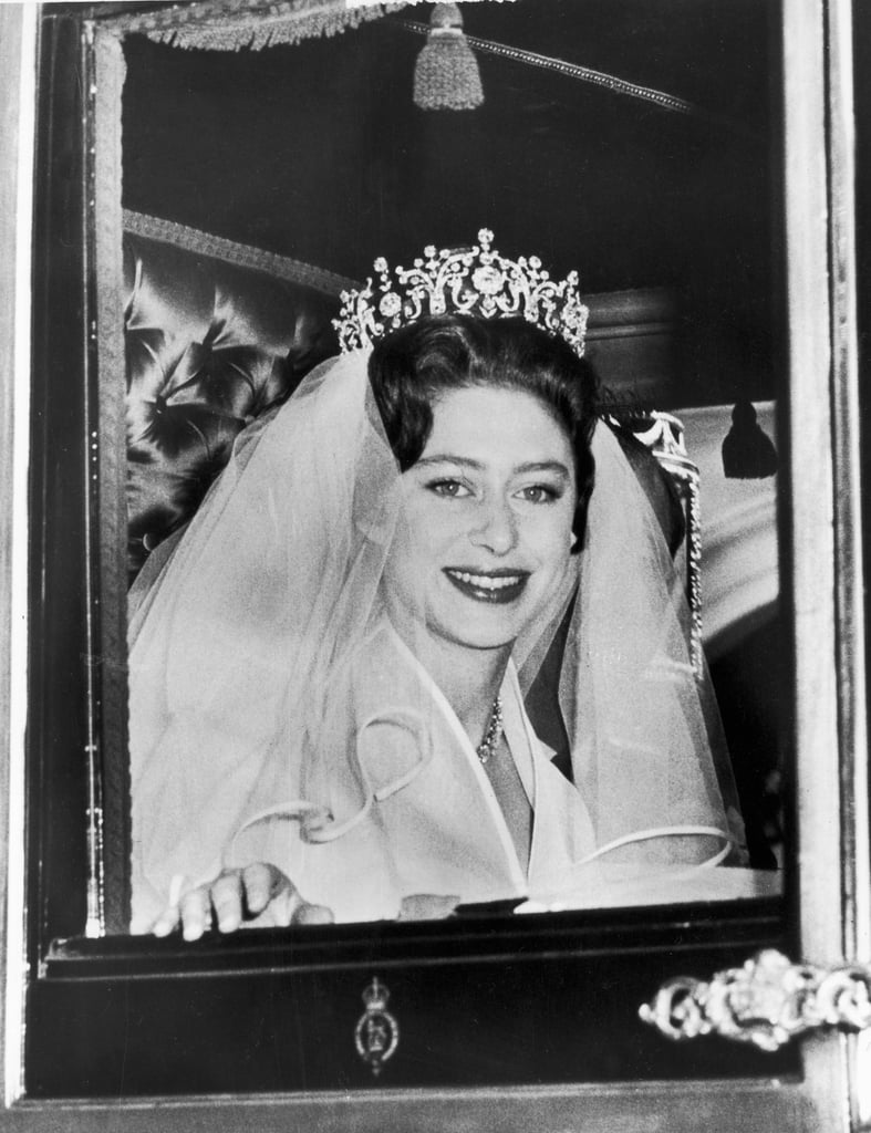 Margaret, who was 29 at the time, famously rode from Clarence House to the Abbey with her brother-in-law, Prince Philip. The Duke of Edinburgh walked Margaret down the aisle and gave her away at the altar. She wore a silk organza dress by Norman Hartnell, who also designed the queen's gown 13 years earlier.