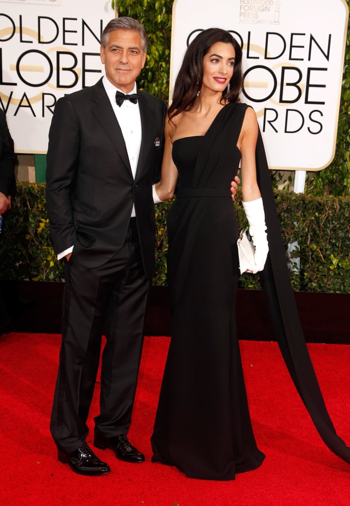 Standing next to her new husband, Amal steals the spotlight. We love the addition of white gloves — so classy and Old Hollywood.