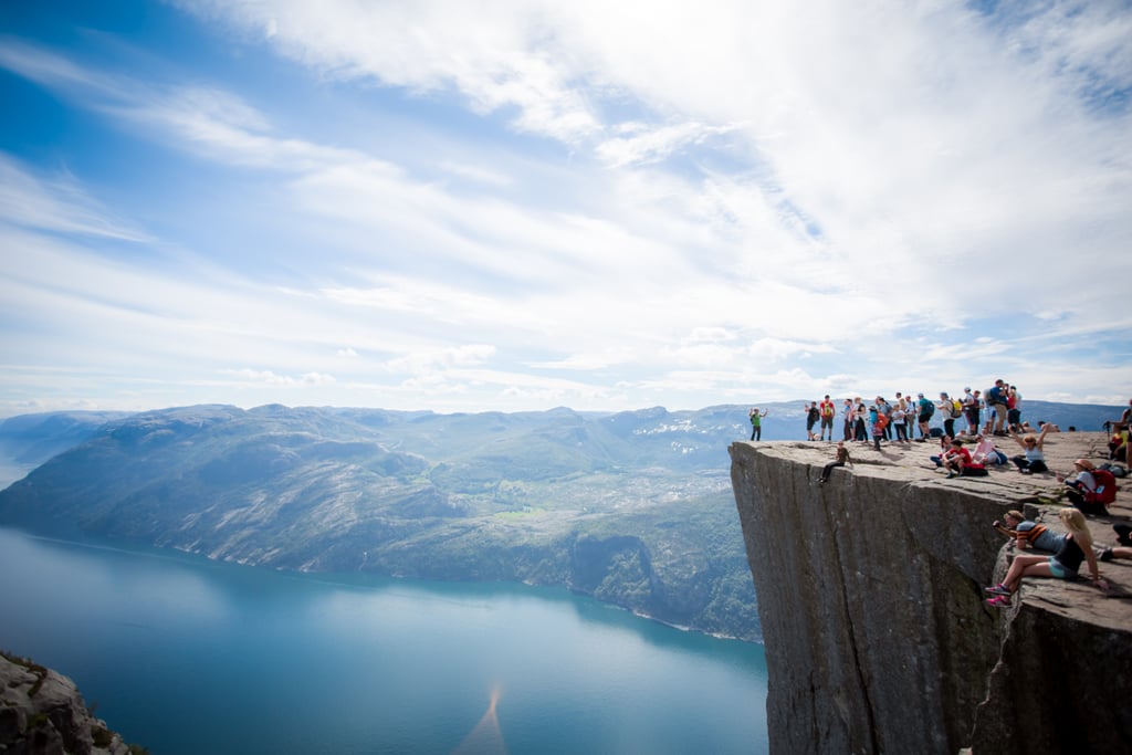 Sit on the Edge of Preikestolen in Norway Sit on the Edge of Preikestolen in Norway