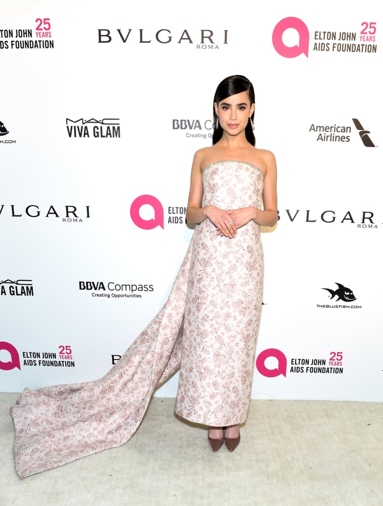 Wearing a Monique Lhuillier floral gown at Elton John AIDS Foundation Oscars party in March 2018.