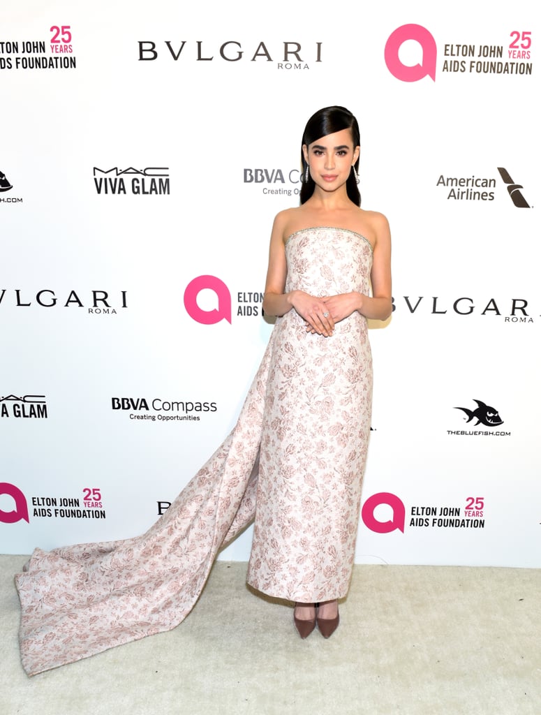 Wearing a Monique Lhuillier floral gown at the Elton John AIDS Foundation Oscars party in March 2018.