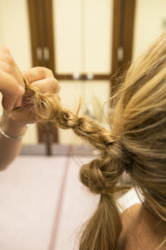 Continue to knot the hair tightly until you reach the end. Secure with an elastic.