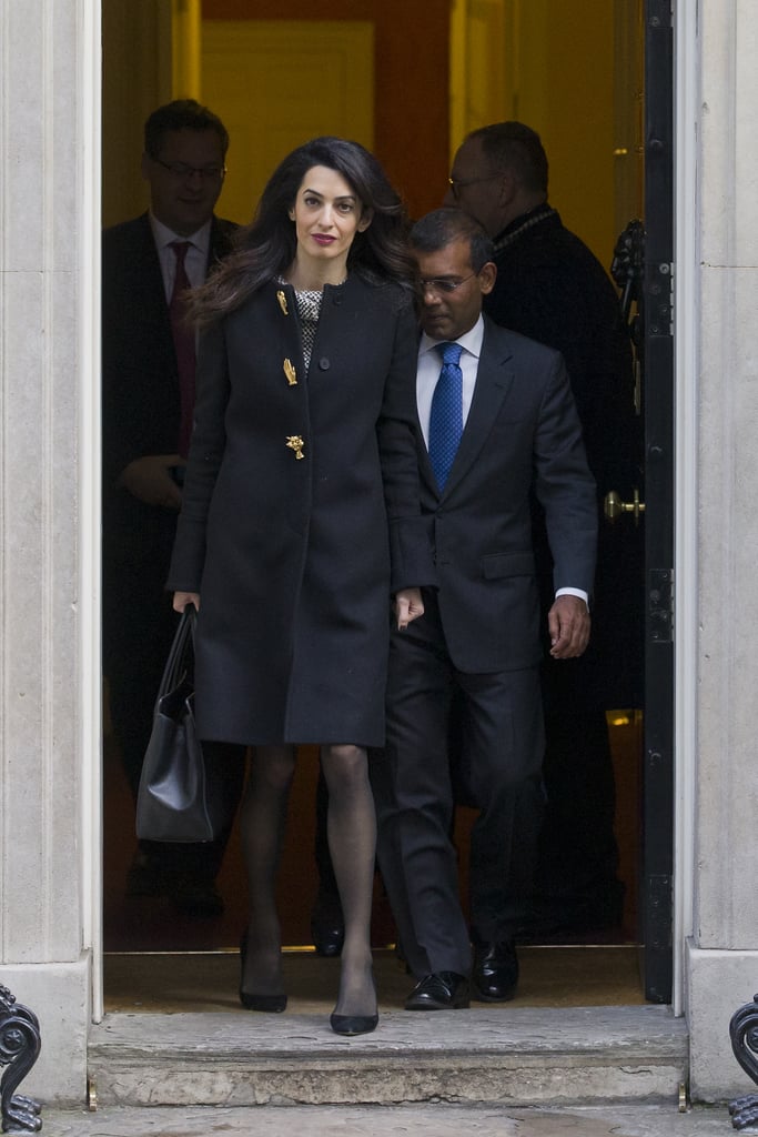 Amal Clooney Wearing a Black Coat With Gold Buttons