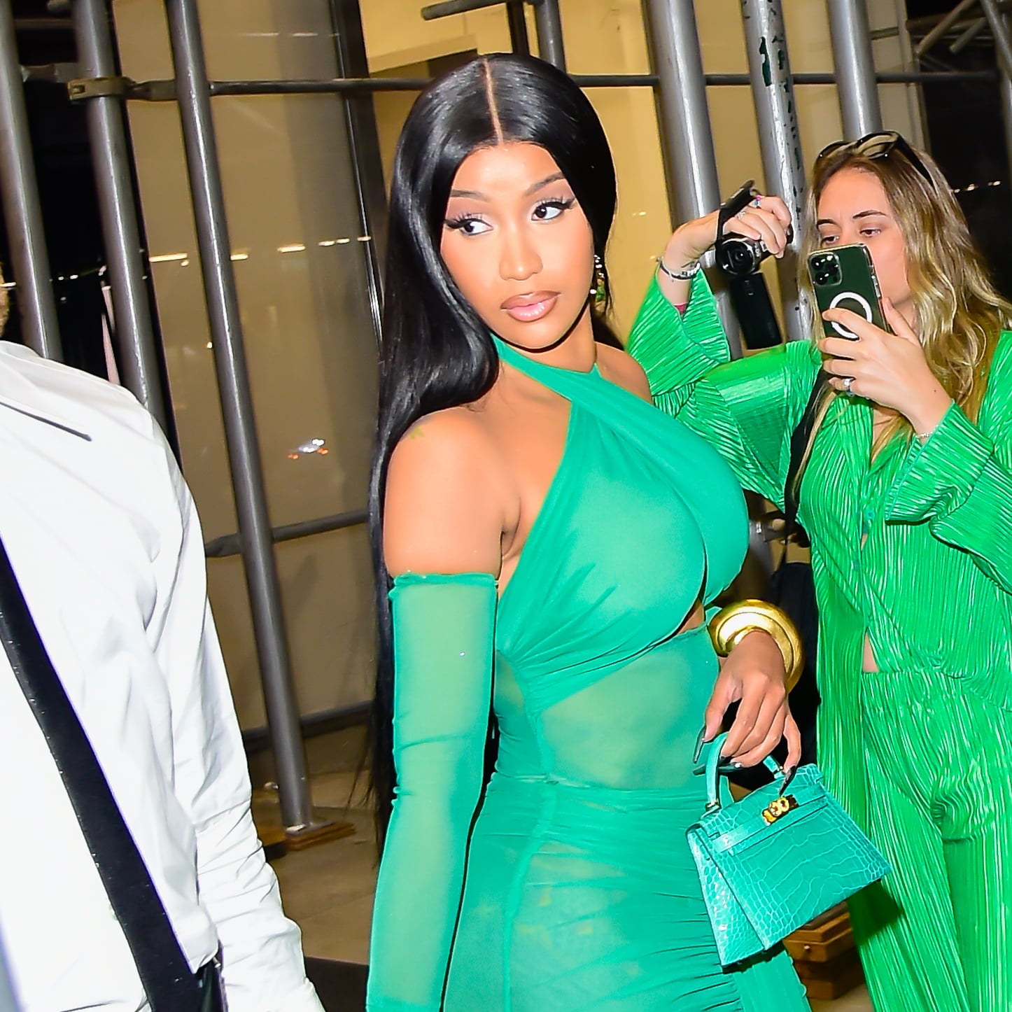 Cardi B Wears an All-Black and Green Look With Oversized Hoops