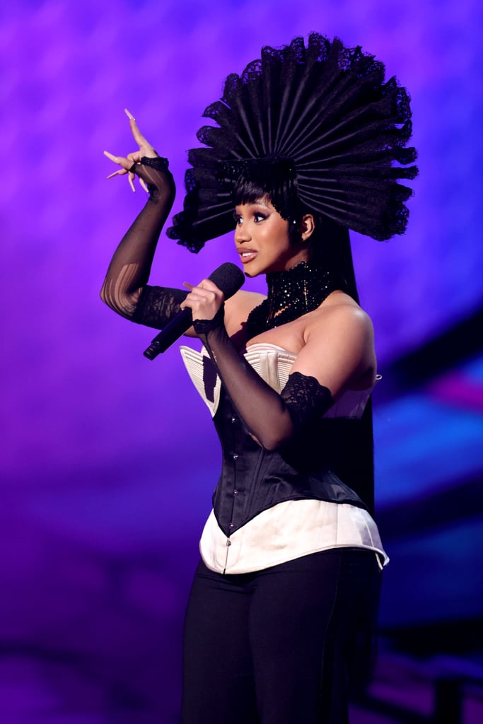 Her lineup also included this look consisting of a black-and-white corset top, sheer gloves, and a fan-like headpiece.