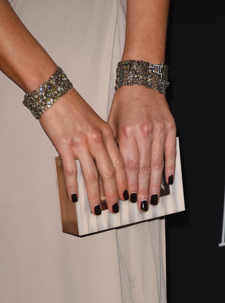 Kate Beckinsale carried a sleek Rauwolf clutch and showed off double the glitz with her cuffs.