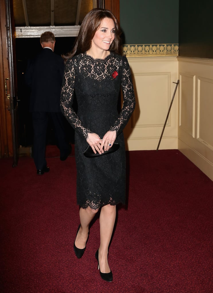 Kate completed her Dolce & Gabbana lace dress with a bright red poppy pin, an Anya Hindmarch clutch, and black pumps.