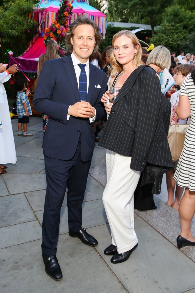 Diane also added a pinstripe blazer to her look, which she casually slung over her shoulder as she posed with David Lauren.