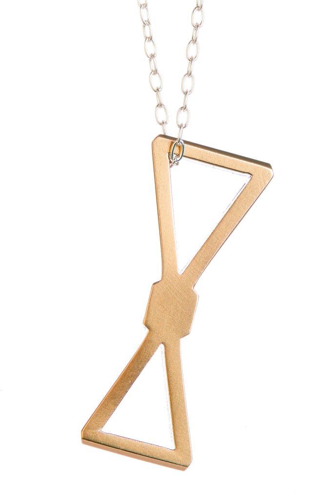 My favorite gift that gives back this year is the LZZR and TieTheKnot.org Bow Tie Necklace ($105).