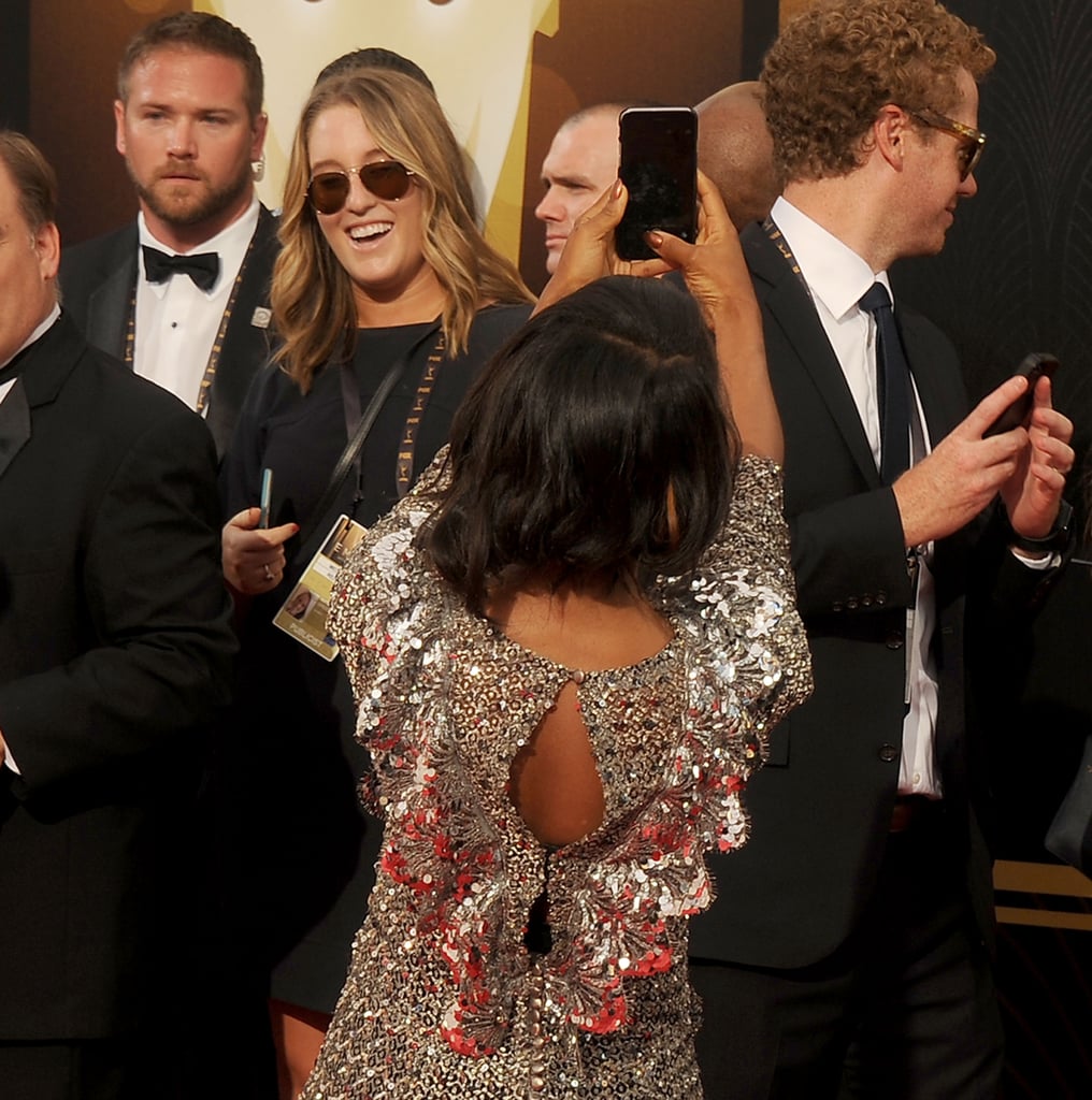 Kerry stopped to snap a selfie of herself while walking the red carpet.