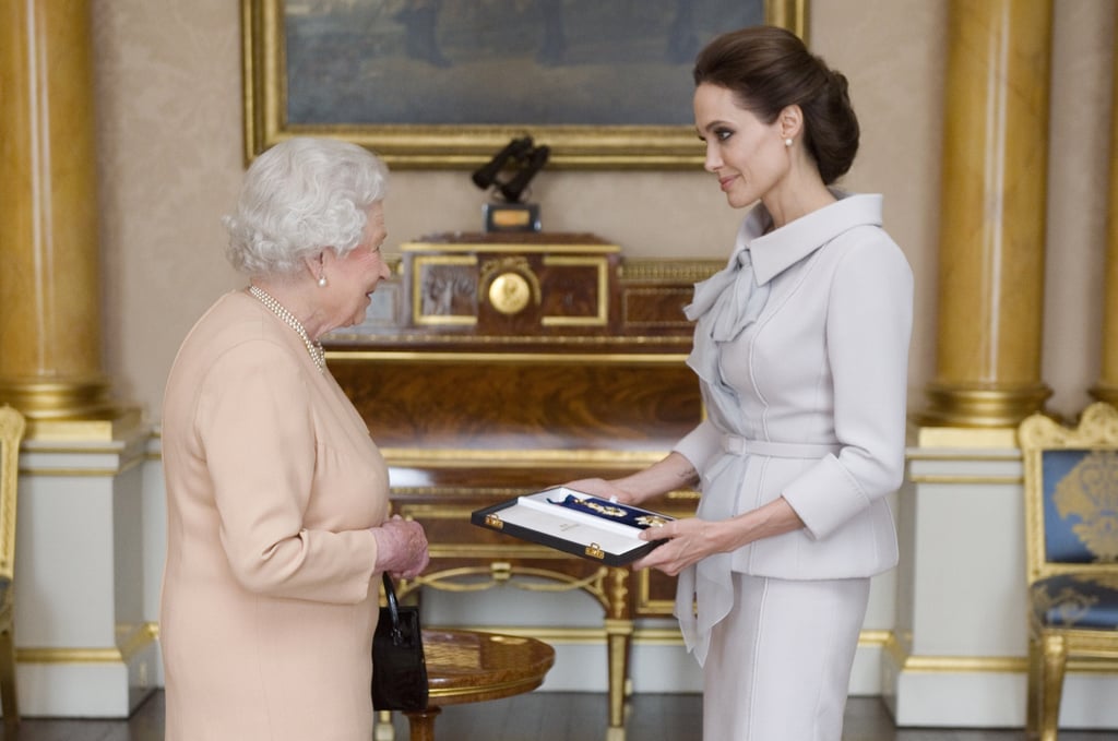 Angelina Jolie, who is 5'7", is a head above Queen Elizabeth II.