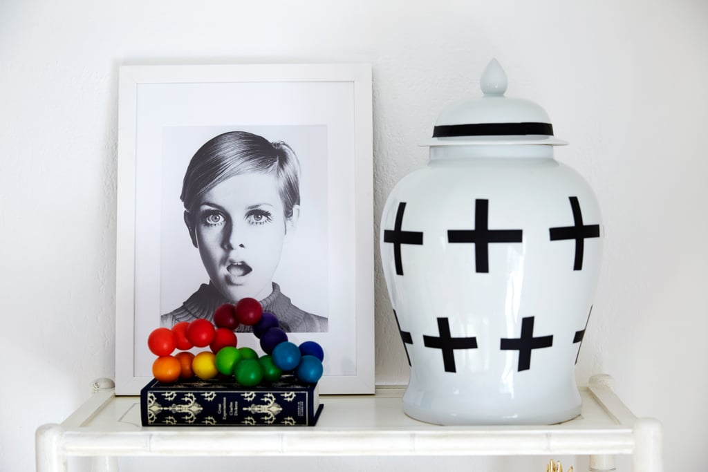 A black-and-white Twiggy portrait is a fun nod to Coco's professional life. The ginger jar, originally a plain white, was made into a graphic piece with the addition of an eye-catching black motif.