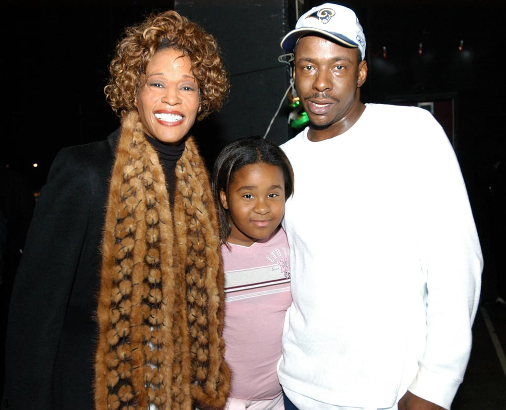 Bobbi was wedged between her famous parents at an Atlanta concert in November 2003.