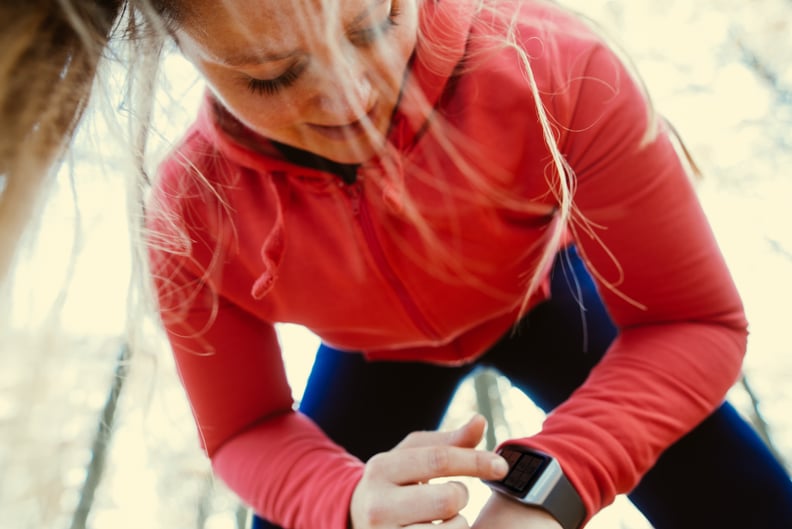 Woman using a smartwatch after jogging