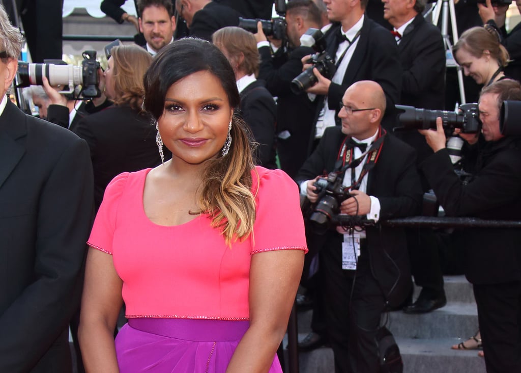 We love how Mindy accessorized her colorful look with some silver drop earrings.